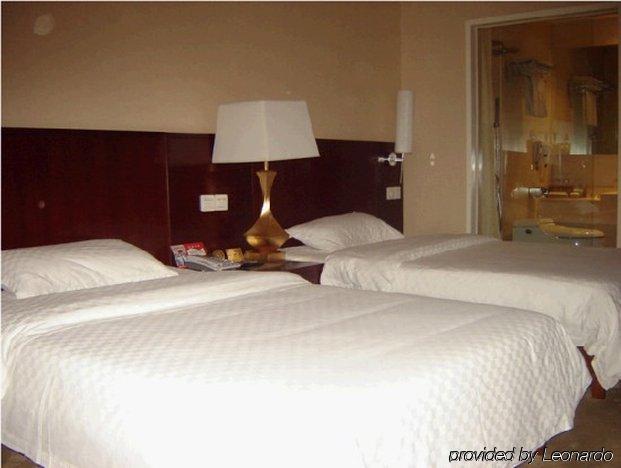 Bluesky Hotel Guangzhou Rum bild